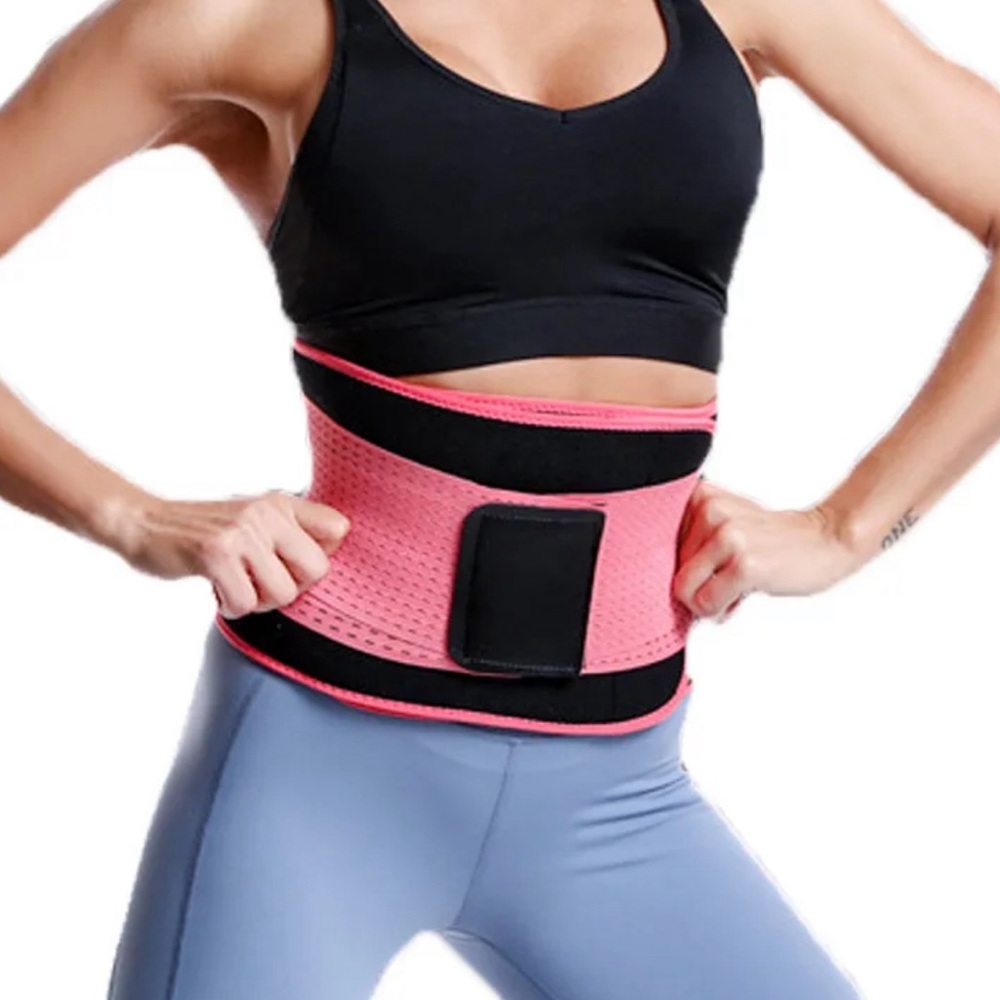 Pink and black waist trainer to use when working out.
